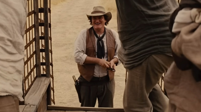 Quentin Tarantino unlocking slaves in a wagon in Django Unchained