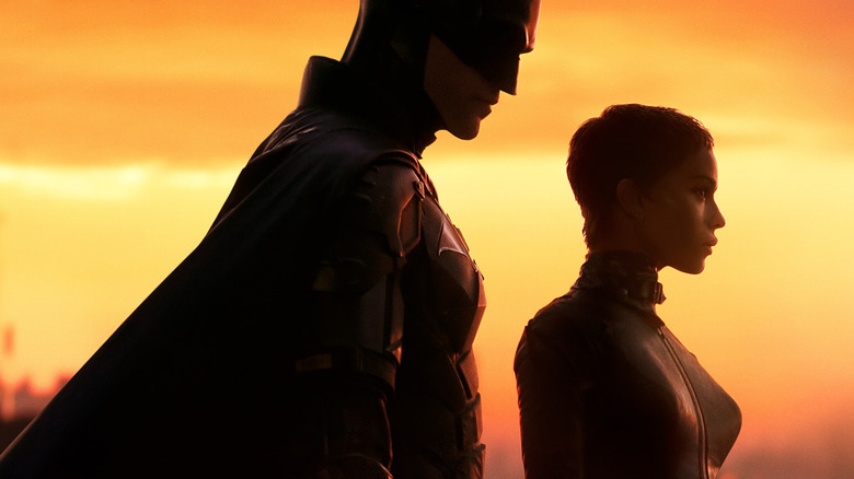 Batman and Catwoman look out over Gotham in 