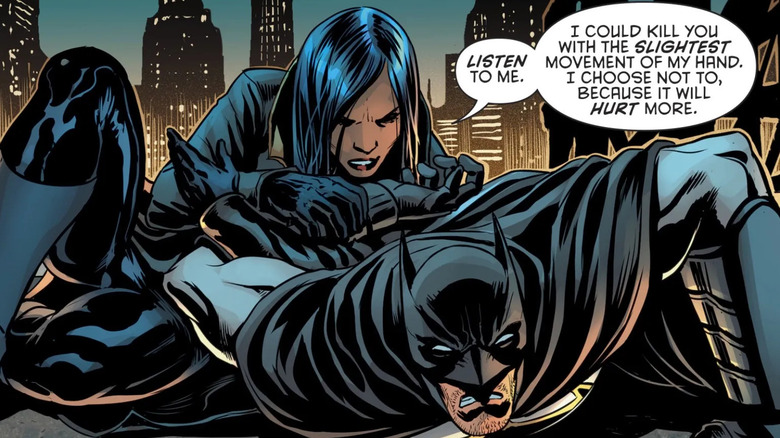 Lady Shiva holds Batman on the ground