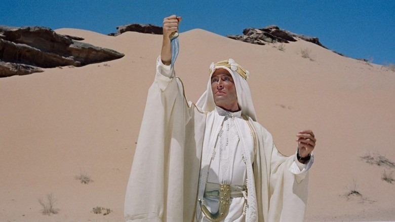 T.E. Lawrence (Peter O'Toole) examines his reflection in a dagger in Lawrence of Arabia