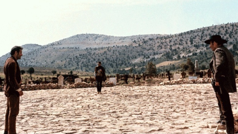 Tuco (Eli Wallach), Blondie (Clint Eastwood), and Angel Eyes (Lee Van Cleef) face each other in a standoff in The Good, the Bad and the Ugly