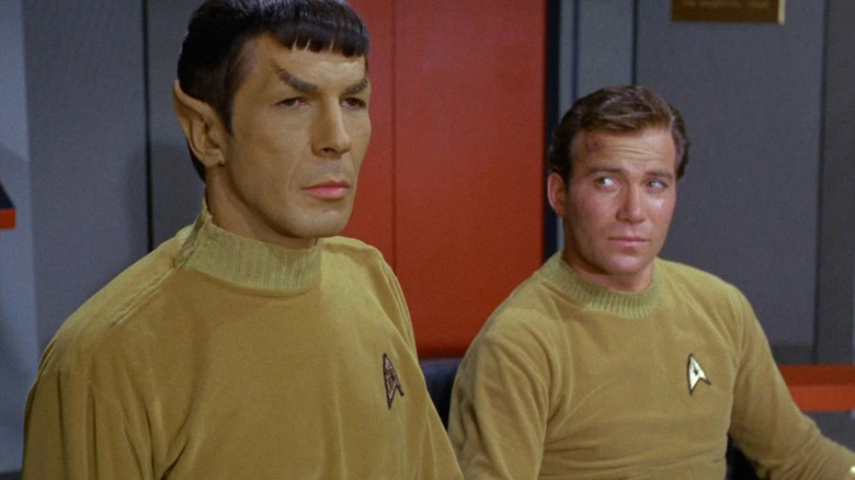 James T. Kirk (William Shatner) glances at Spock (Leonard Nimoy) in Star Trek: The Original Series