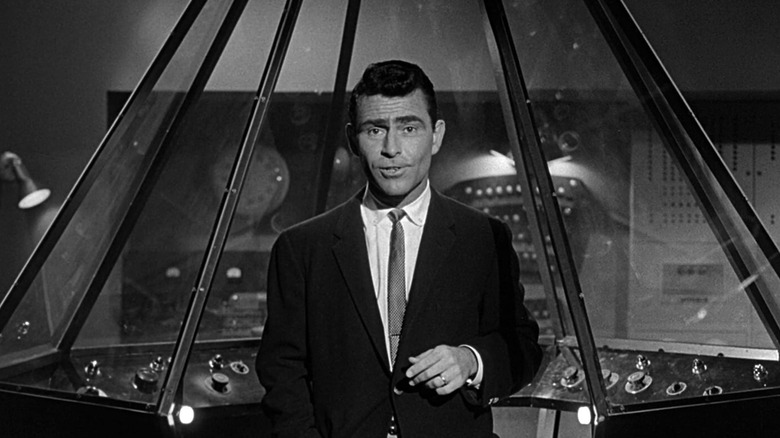Rod Serling speaks to the camera in front of a futuristic console in The Twilight Zone (1959)