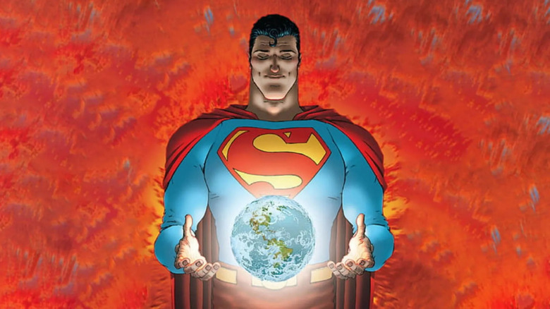 Superman holds the world in his hand, smiling in DC Comics