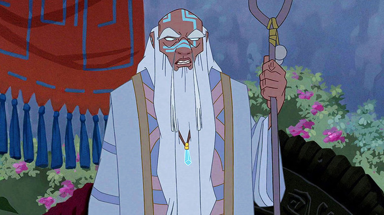 Kashekim Nedakh (Leonard Nimoy) stands holding a staff in Atlantis: The Lost Empire