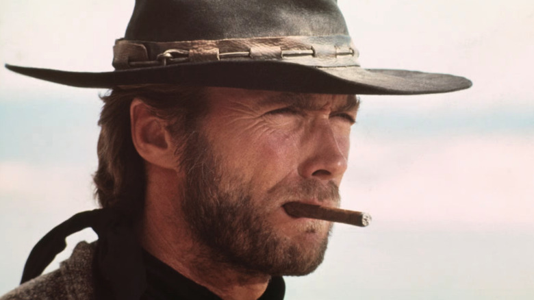 The Stranger (Clint Eastwood) smokes a cigar in High Plains Drifter
