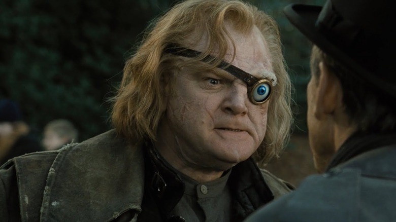 Brendan Gleeson as Alastor "Mad-Eye" Moody in Harrry Potter in the Goblet of Fire, looking angry while talking to someone.