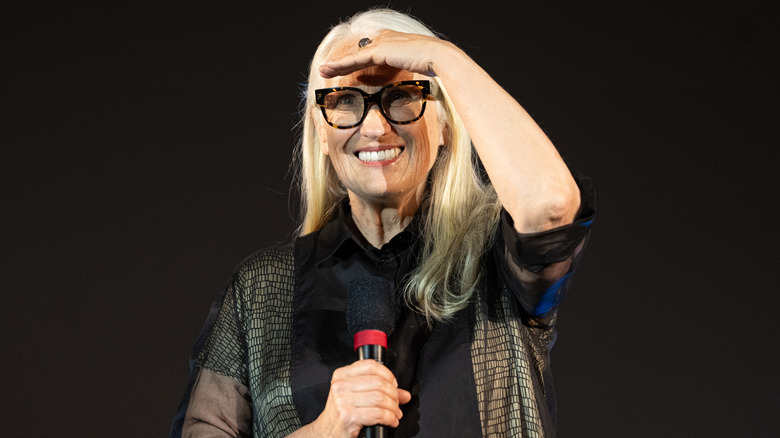 Jane Campion holding a microphone and speaking at an event