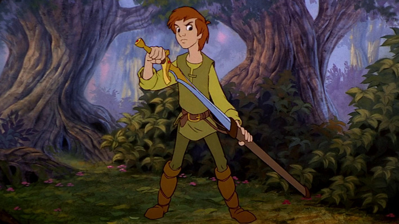 Taran holding a sword in the woods in The Black Cauldron