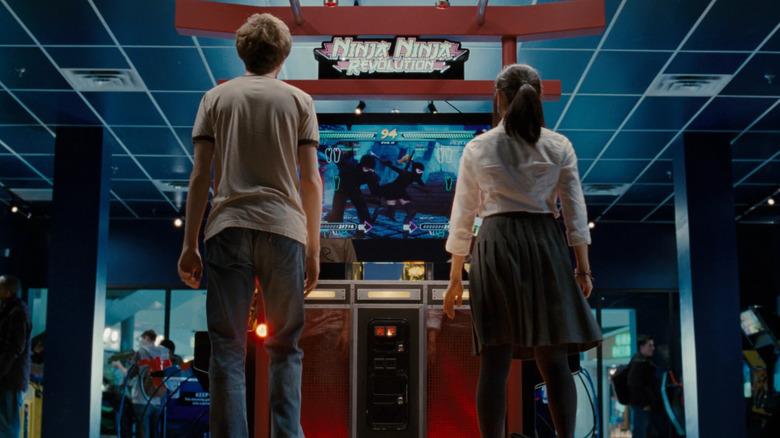 Scott Pilgrim (Michael Cera) and Knives (Ellen Wong) playing Ninja Ninja Revolution in Scott Pilgrim vs. the World