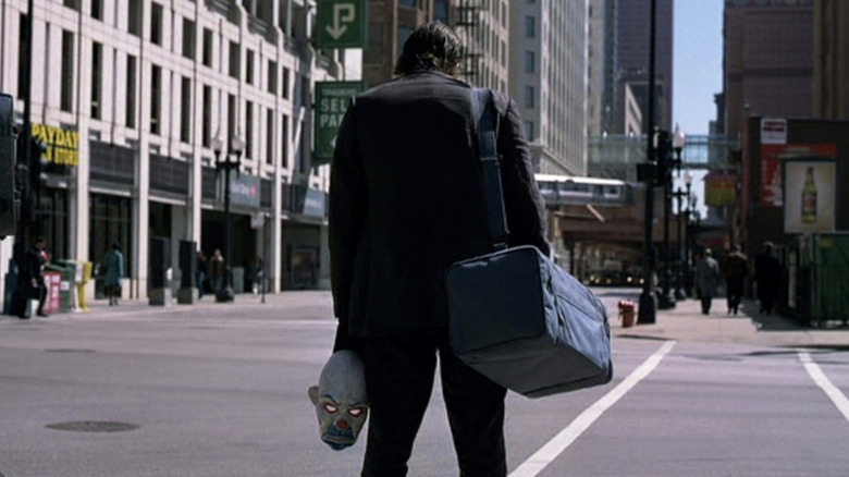 The Joker (Heath Ledger) waits for a ride in The Dark Knight