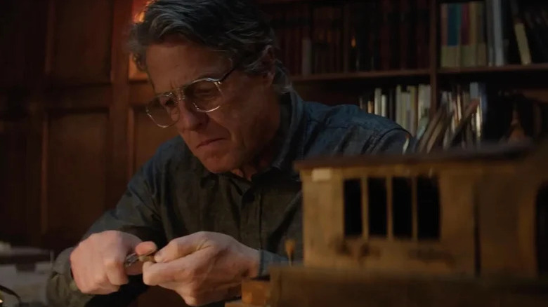 Mr. Reed (Hugh Grant) tinkers away in Heretic