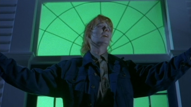 Bobbi Anderson (Marg Helgenberger) pleads in front of supernatural forces in The Tommyknockers