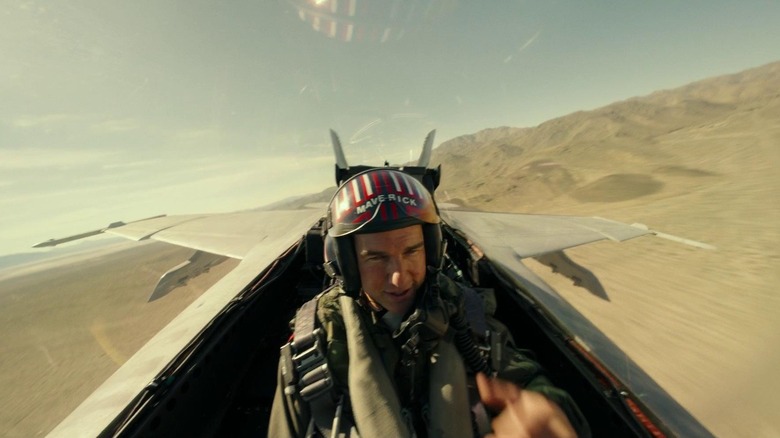 Captain Pete "Maverick" Mitchell (Tom Cruise) flies a jet in Top Gun: Maverick