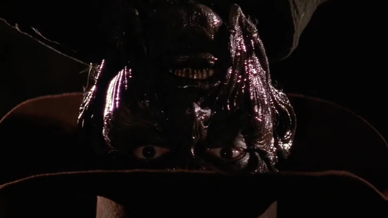 Jonathan Breck as the Creeper hangs upside down in Jeepers Creepers
