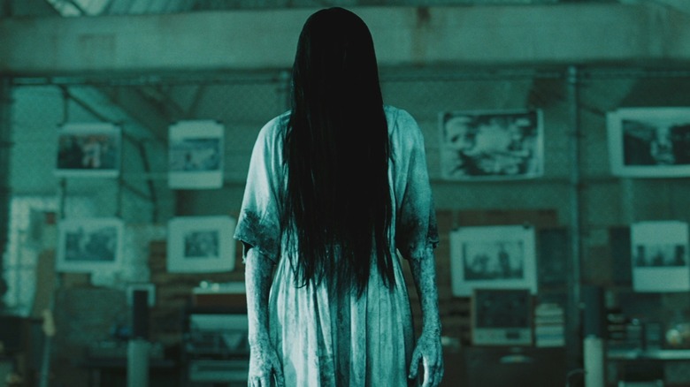 Daveigh Chase as Samara Morgan looks creepy in a room in The Ring