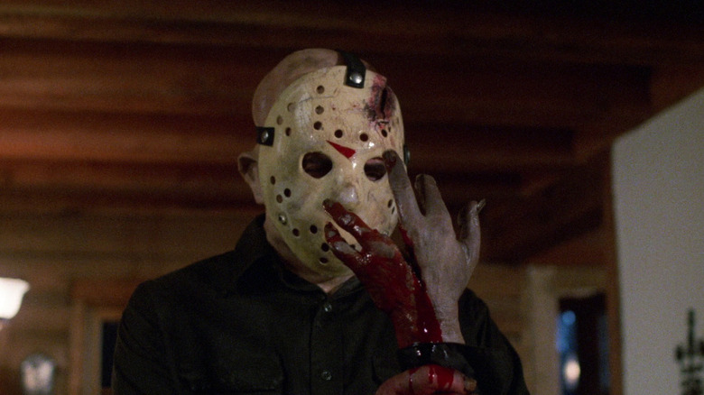 Jason holds up his bloody hand in Friday the 13th: The Final Chapter