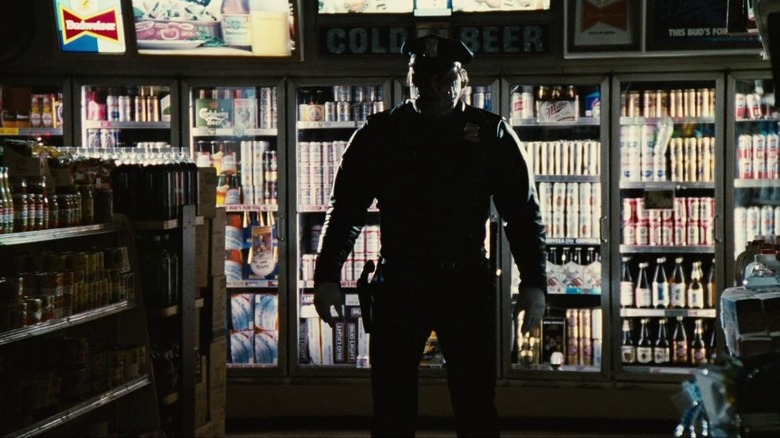 Cordell stands in the shadows of a convenience store in Maniac Cop 2