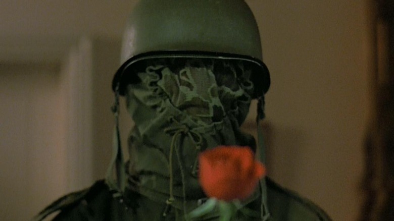 Military man with rose
