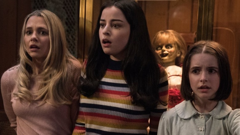 Madison Iseman, Katie Sarife and McKenna Grace scared doll