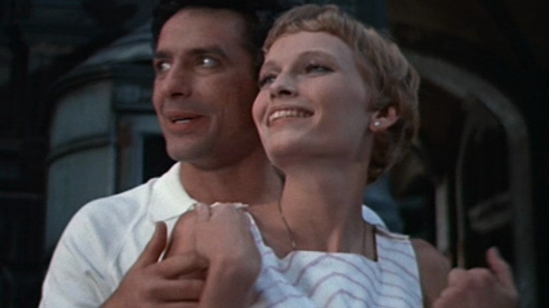 John Cassavettes and Mia Farrow smile