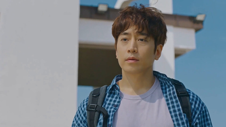 Jun Ji-hoon (Eric Mun) stands outside wearing a backpack in The Spies Who Loved Me