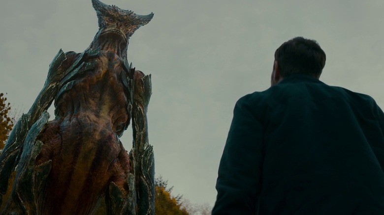 The monster stares down at Oscar (Jason Sudekis) in Colossal