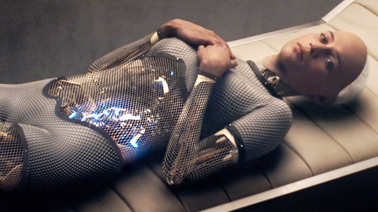 Alicia Vikander as Ava lies on a chair in Ex Machina