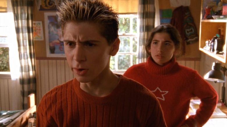 Cynthia (Tania Raymonde) looking at Reese (Justin Berfield) from behindon Malcolm in the Middle