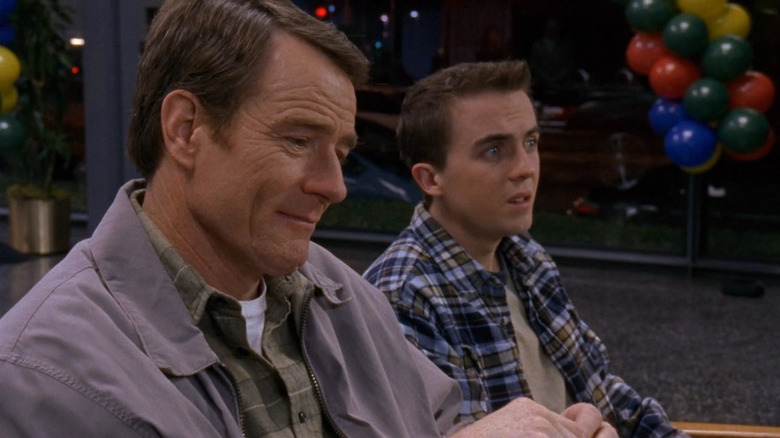 Hal (Bryan Cranston) tearing up next to Malcolm (Frankie Muniz) on Malcolm in the Middle