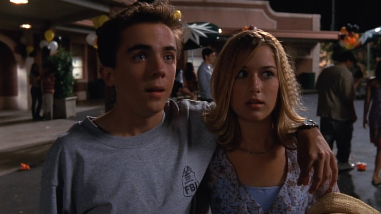 Malcolm (Frankie Muniz) with his arm around Alison (Brittany Renee Finamore) on Malcolm in the Middle