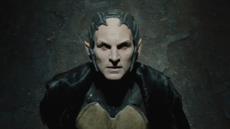 Christopher Eccleston as Malekith looking toward the light in Thor: The Dark World