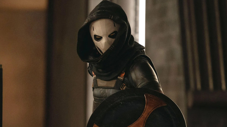Olga Kurylenko as Taskmaster looking through a hood in Thunderbolts