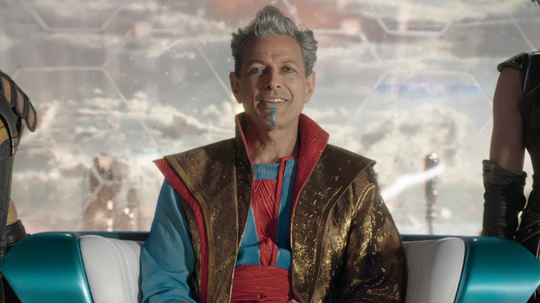 Jeff Goldblum as the Grandmaster sitting on a throne in Thor: Ragnarok