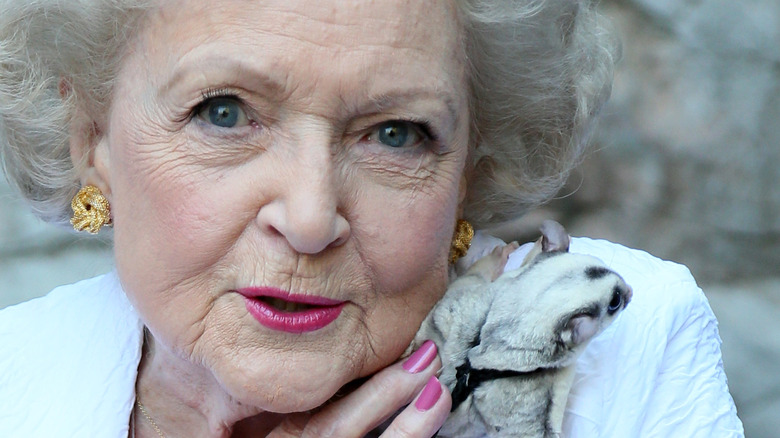 Betty White holding an animal
