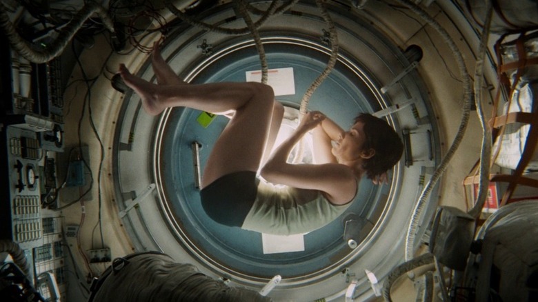 Dr. Ryan Stone (Sandra Bullock) inside a spaceship in Gravity