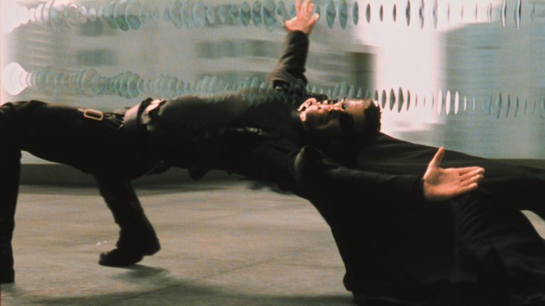 Neo (Keanu Reeves) dodging bullets in The Matrix