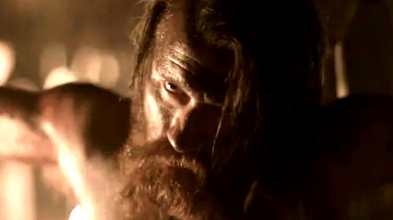 Jarl Borg (Thorbjørn Harr) kneels shirtless with his arms outstretched in Vikings