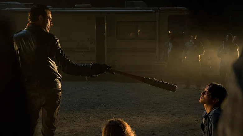 Negan (Jeffrey Dean Morgan) points a barbed baseball bat at Glenn Rhee (Steven Yeun) in The Walking Dead