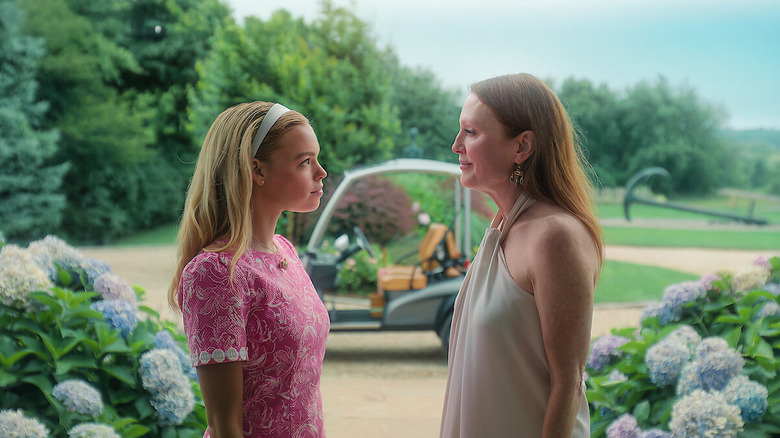 Milly Alcock as Simone DeWitt and Julianne Moore as Michaela Kell, talking in a garden in Sirens