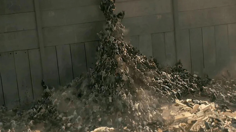 Zombies climbing a wall in World War Z