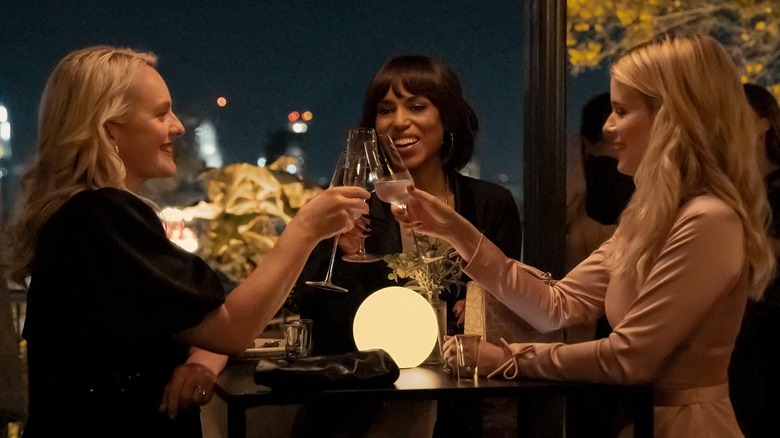 Elisabeth Moss as Mary, Kerry Washington as Eleanor, and Kate Mara as Nancy in Imperfect Women, standing around table and toasting champagne glasses.
