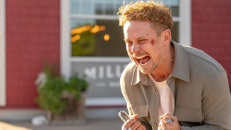 Billy Magnussen as Duncan Park in The Audacity, with a slight cut on his face as he clenches his fists and screams.