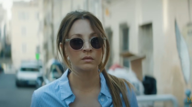 Kaley Cuoco as Alice Monroe in Vanished, wearing sunglasses and walking down a European street.