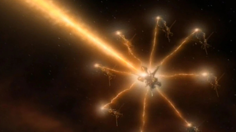A group of Species 8472 vessels fire a massive collective energy beam in Star Trek: Voyager