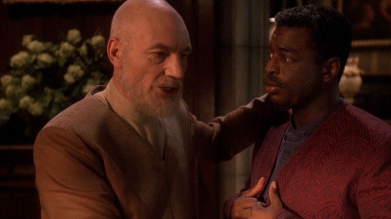 An older Jean-Luc Picard (Patrick Stewart) puts his arm around Geordi La Forge (LeVar Burton) in Star Trek: The Next Generation