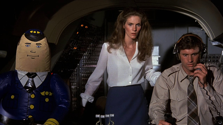Ted (Robert Hays) and Elaine (Julie Hagerty) with an inflatable pilot in Airplane!