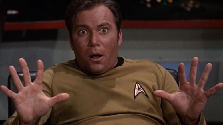 James T. Kirk (William Shatner) holds up his hands in shock in Star Trek: The Original Series