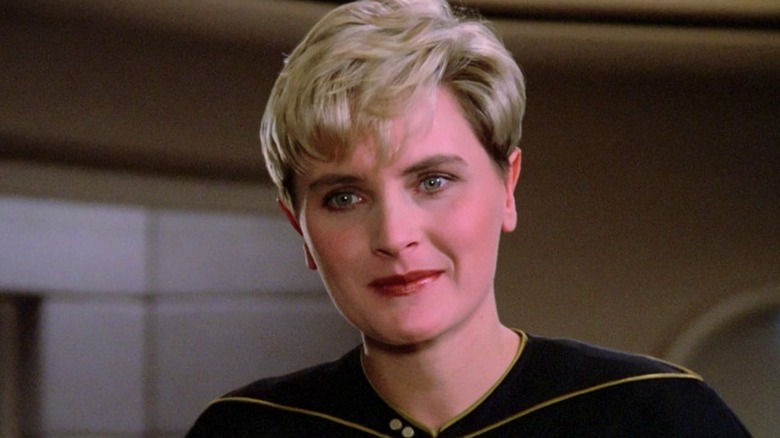 Tasha Yar (Denise Crosby) smiles on the bridge in Star Trek: The Next Generation