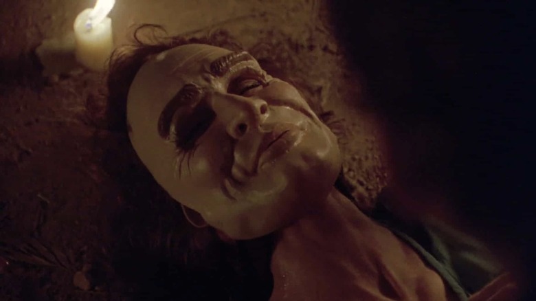 the killer's mask on a potential victim in The First Power